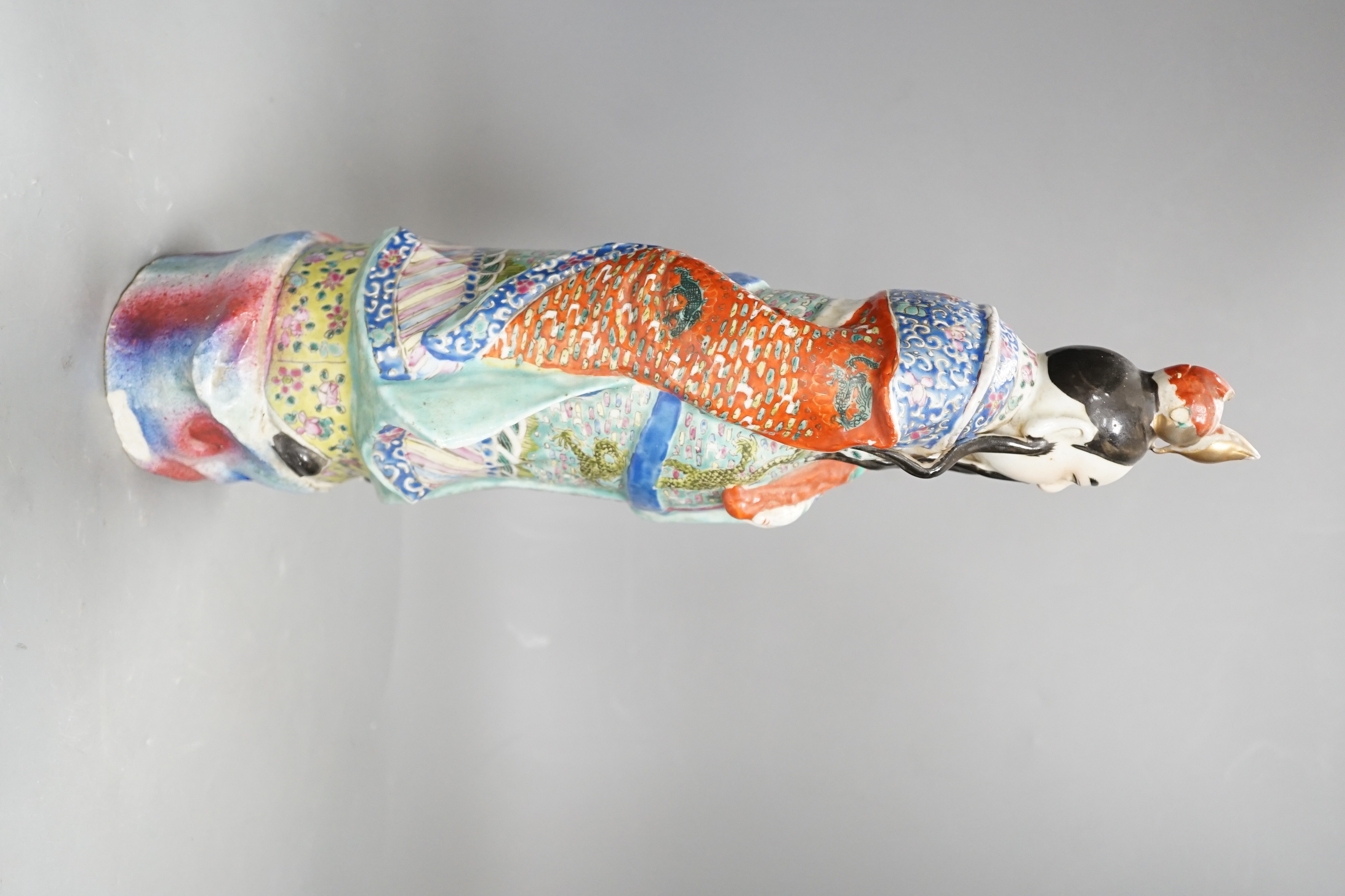 A Chinese enamelled porcelain figure of an immortal, early 20th century, 43cm